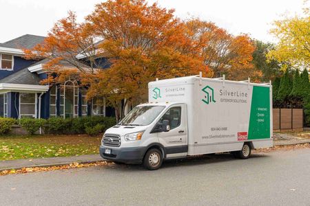 The SilverLine van parked outside a customer's house in the morning