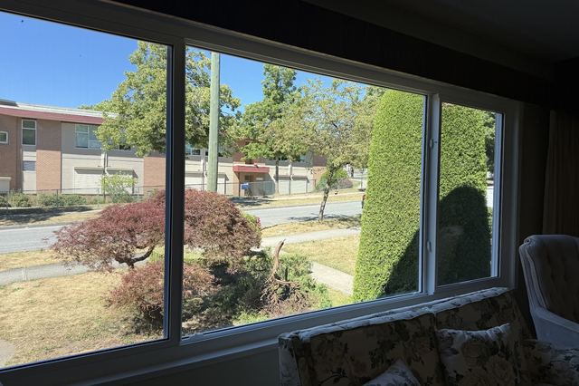 A replaced living room window seen from the sofa